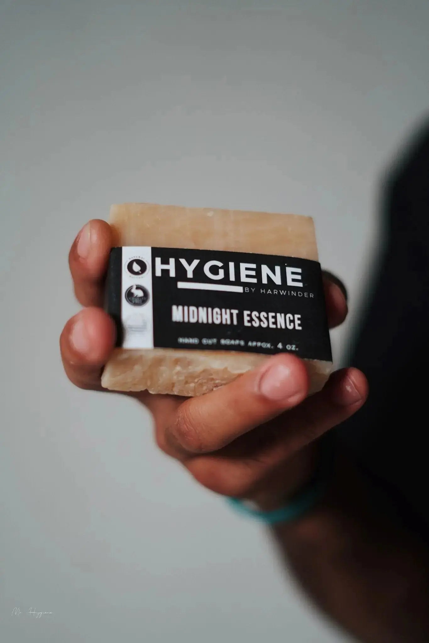 Person holding Midnight Essence Bar Soap – Bold Scent, Deep Clean in hand