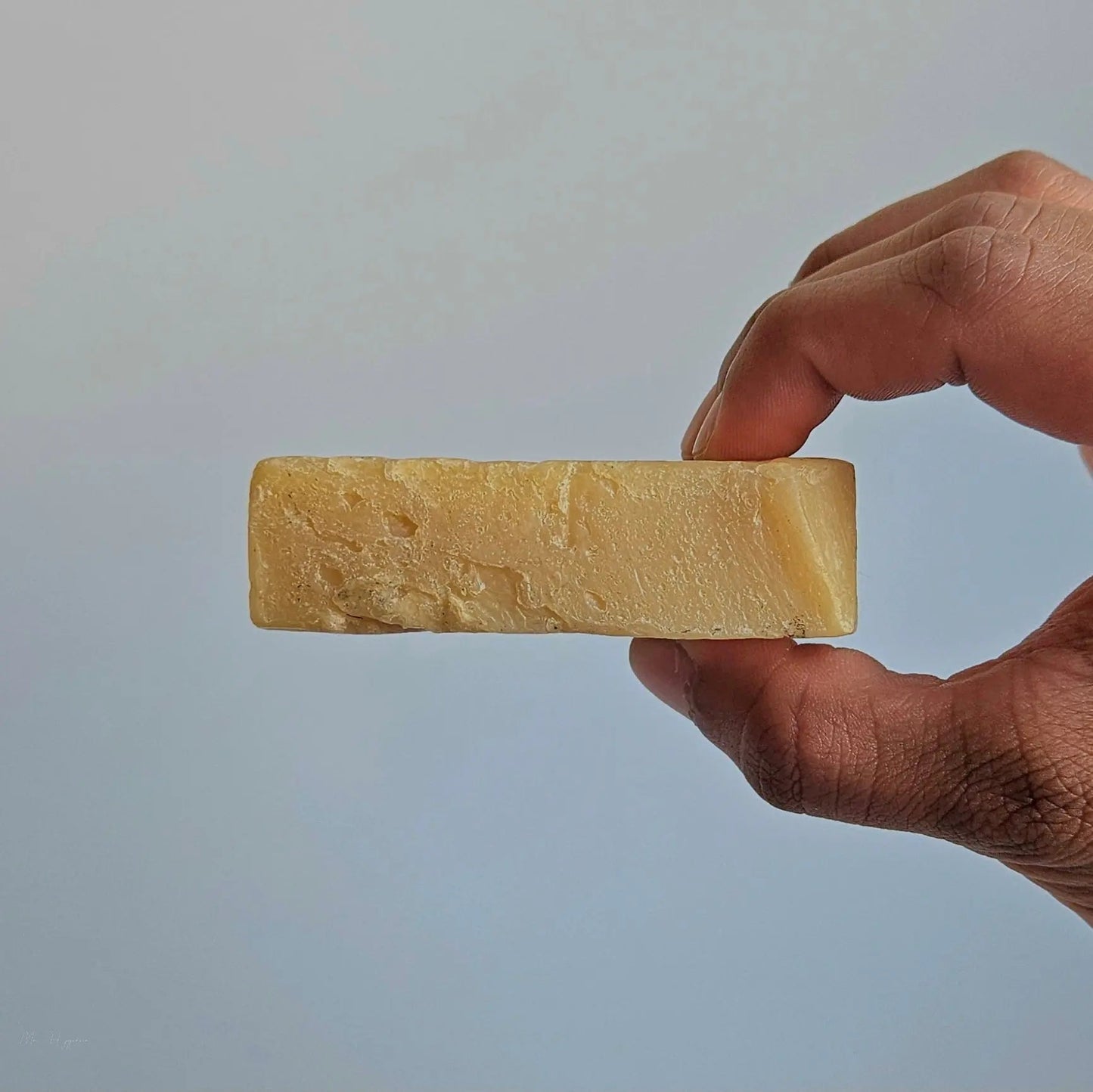 Hand holding Midnight Essence Bar Soap – Bold Scent, Deep Clean, showcasing its natural and eco-friendly design for invigorating skin care.