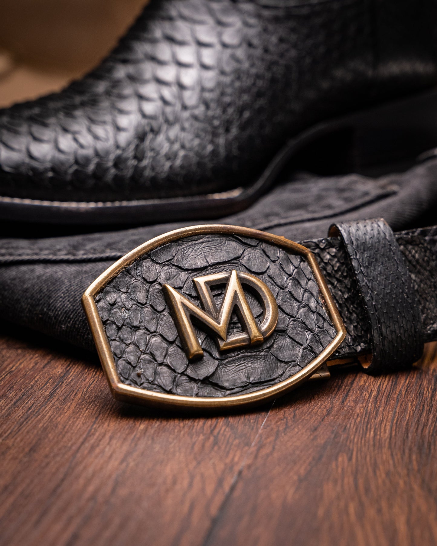 Missouri Black cowboy boot with genuine Python skin and leather belt, showcasing premium craftsmanship and exotic materials.