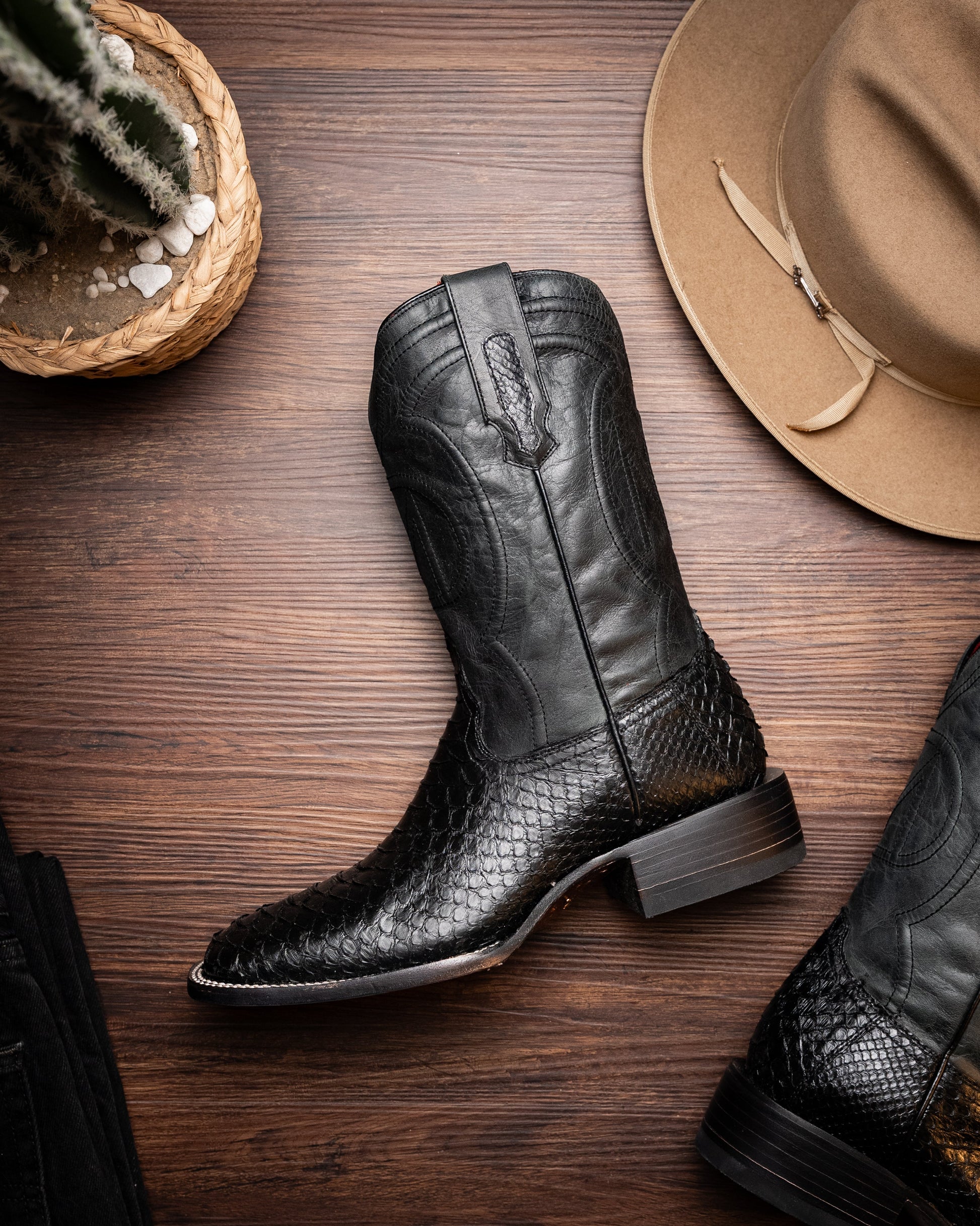 Missouri Black Genuine Python Skin Cowboy Boot with square toe design on wooden floor, part of Western Collection.