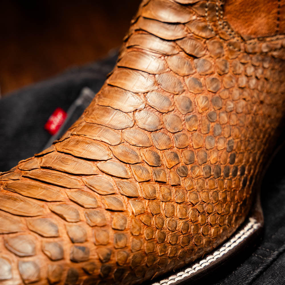 Close-up of Missouri Cognac cowboy boot with genuine Python skin texture.
