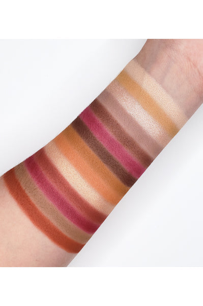 Swatches of Go2 MODERN FAIRYTALE - GES07 eyeshadow palette with neutral to deep berry tones on arm.