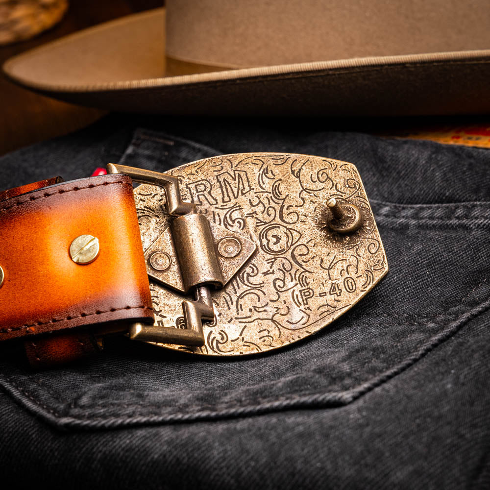 Montana Belt Aged Maple with ornate buckle on denim and hat backdrop