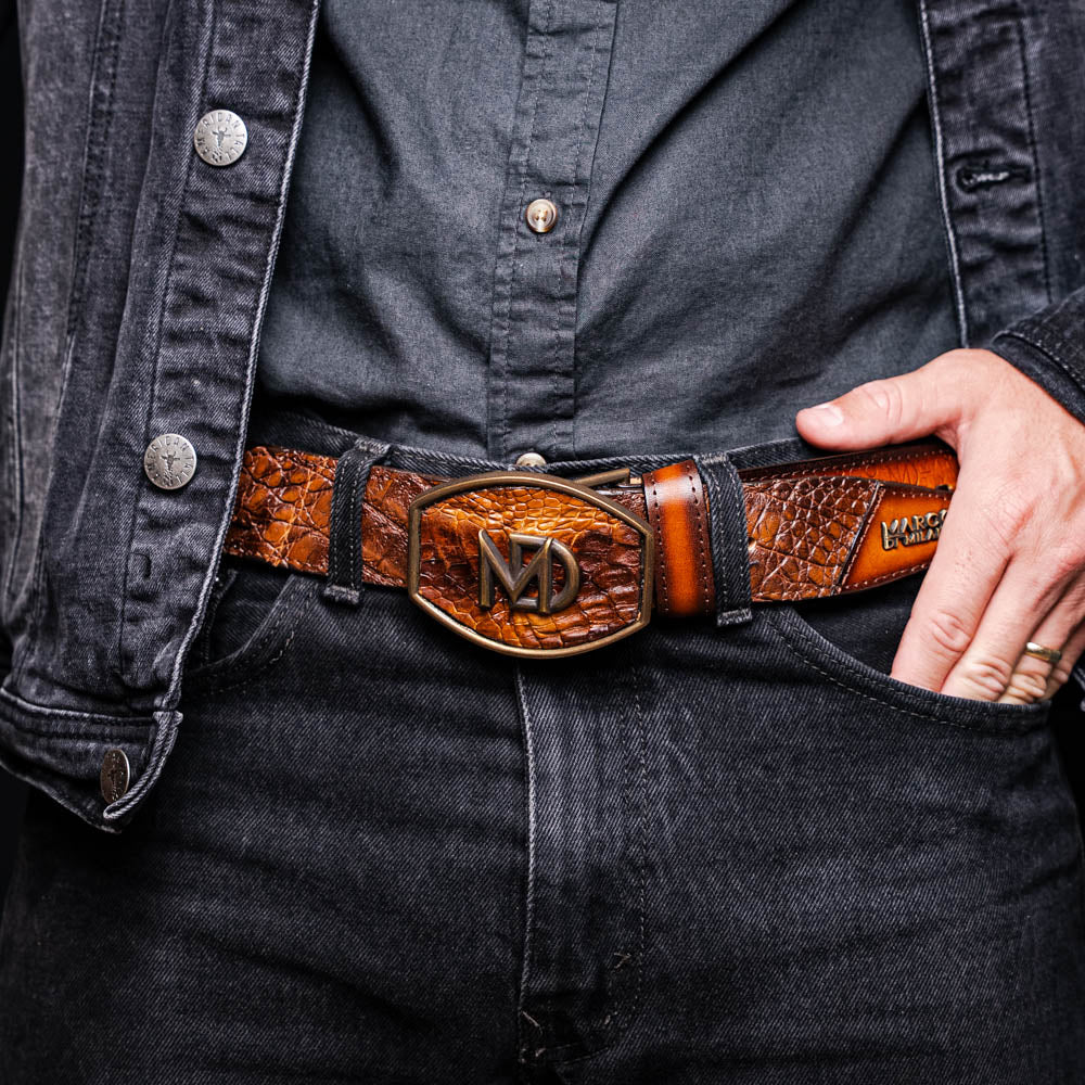 Man wearing Montana Belt Aged Maple with caiman crocodile skin and calfskin, featuring Marco Di Milano brand stamp and stitched detail.