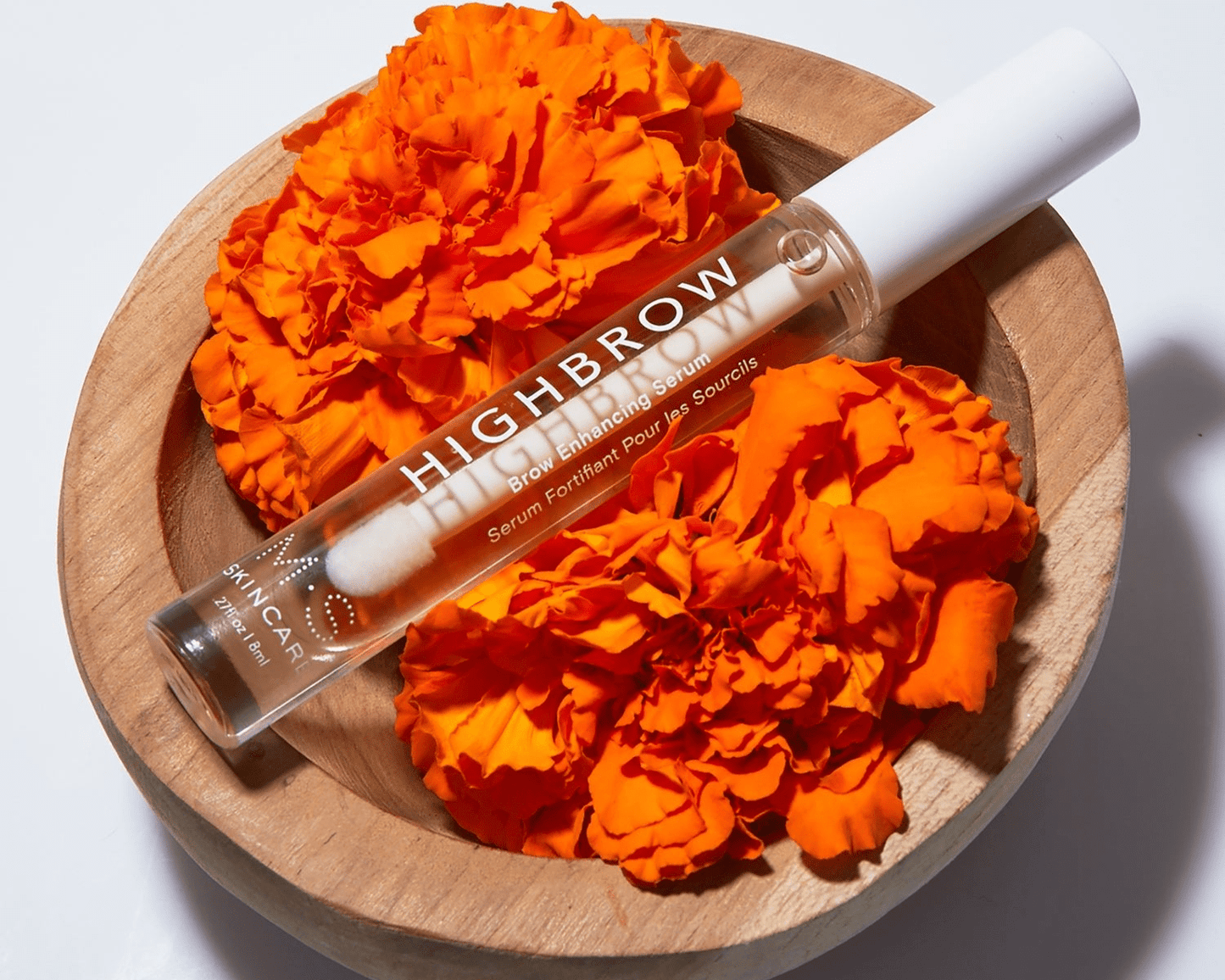 HIGHBROW brow treatment serum with marigold flowers, nourishing natural ingredients for fuller, healthier eyebrows.