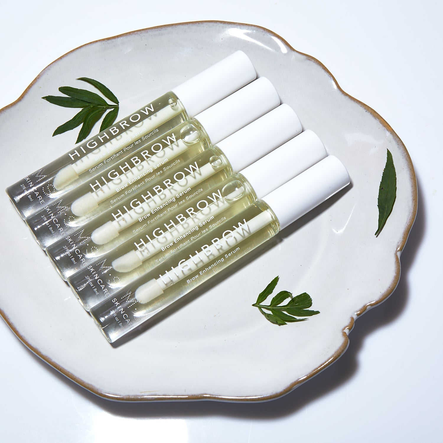 HIGHBROW nourishing overnight brow treatment oils displayed on decorative plate