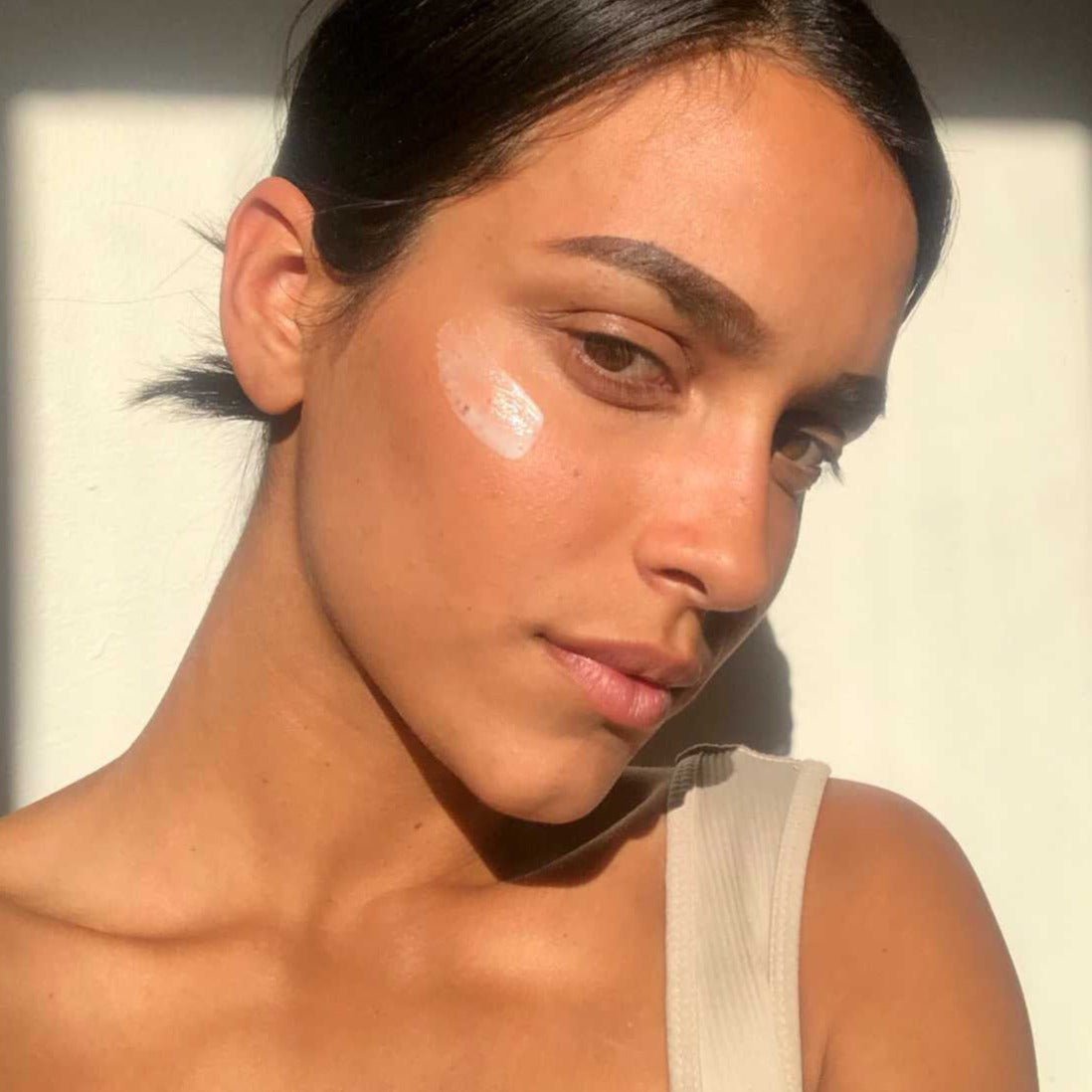 Model using ROSEWATER CREAM for a glowing complexion