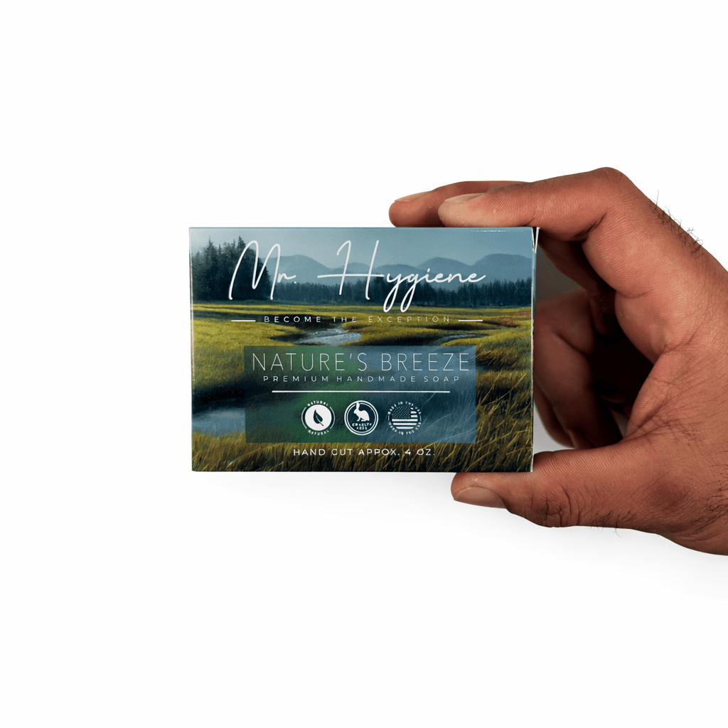 Hand holding box of premium Nature’s Breeze Bar Soap for men, highlighting natural ingredients for deep cleansing and hydration.