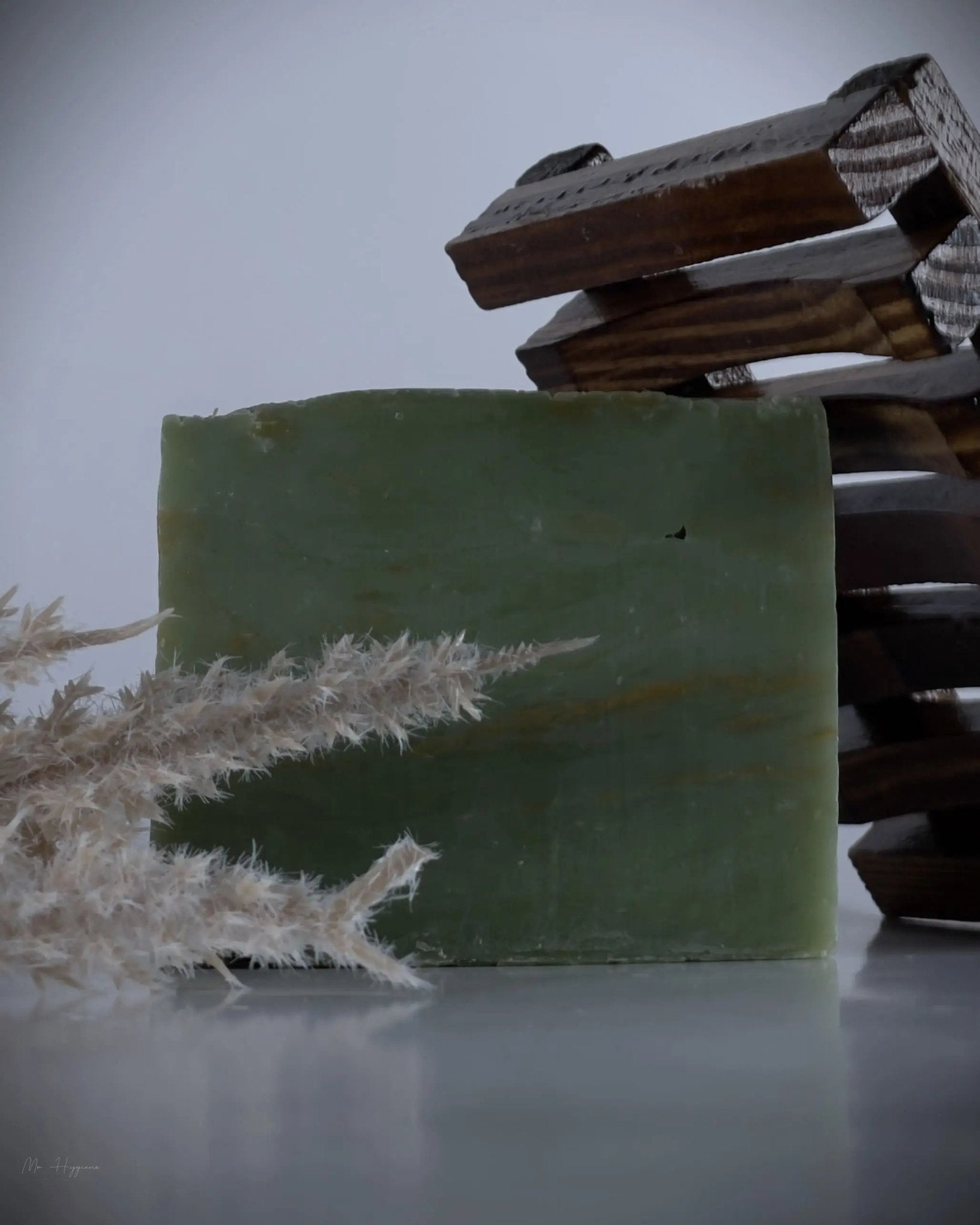 Nature’s Breeze Bar Soap with natural ingredients and wooden soap dish in a serene setting for men’s grooming care.