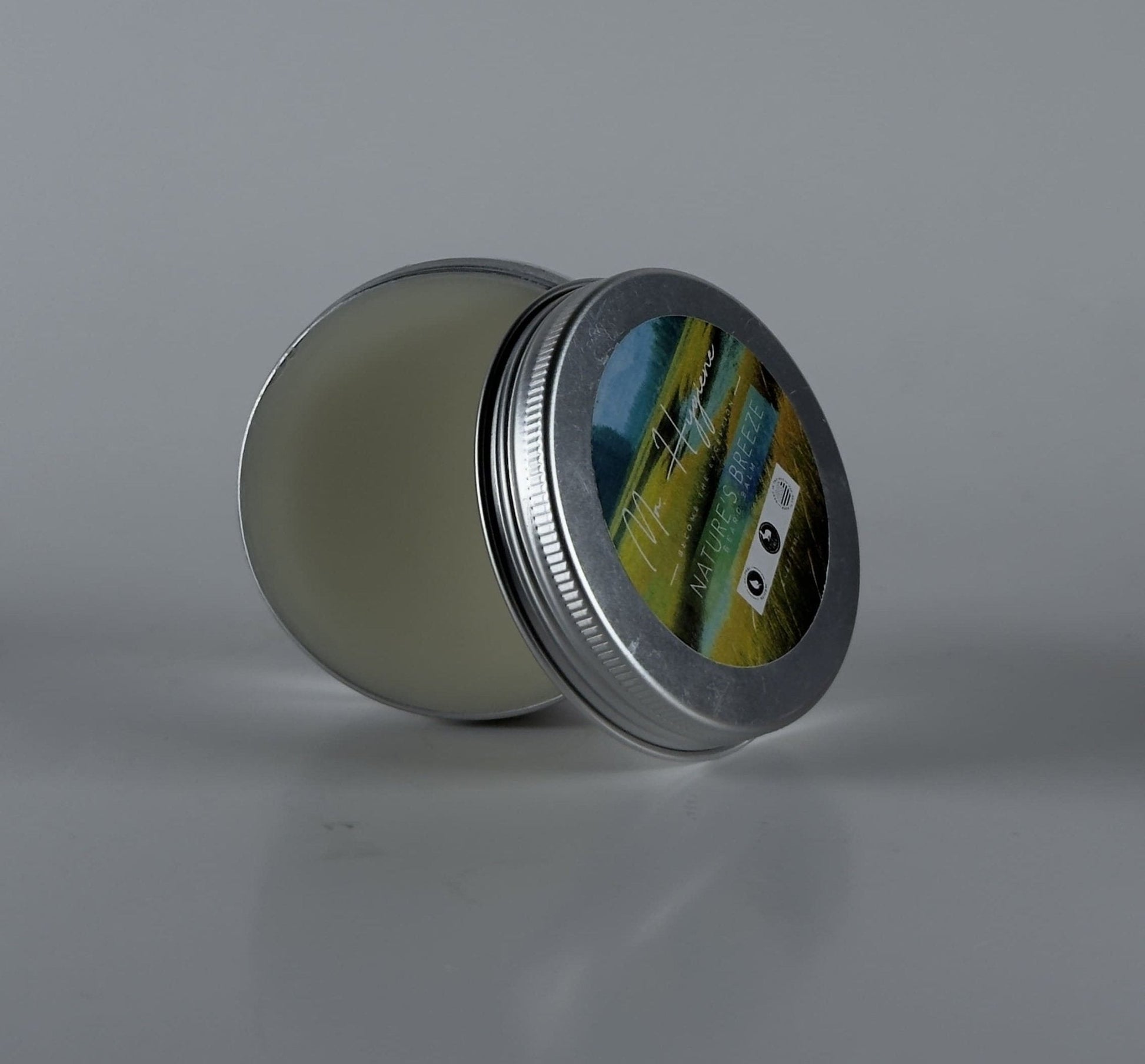 Nature's Breeze Organic Beard Balm tin with open lid showcasing nourishing balm inside for beard care