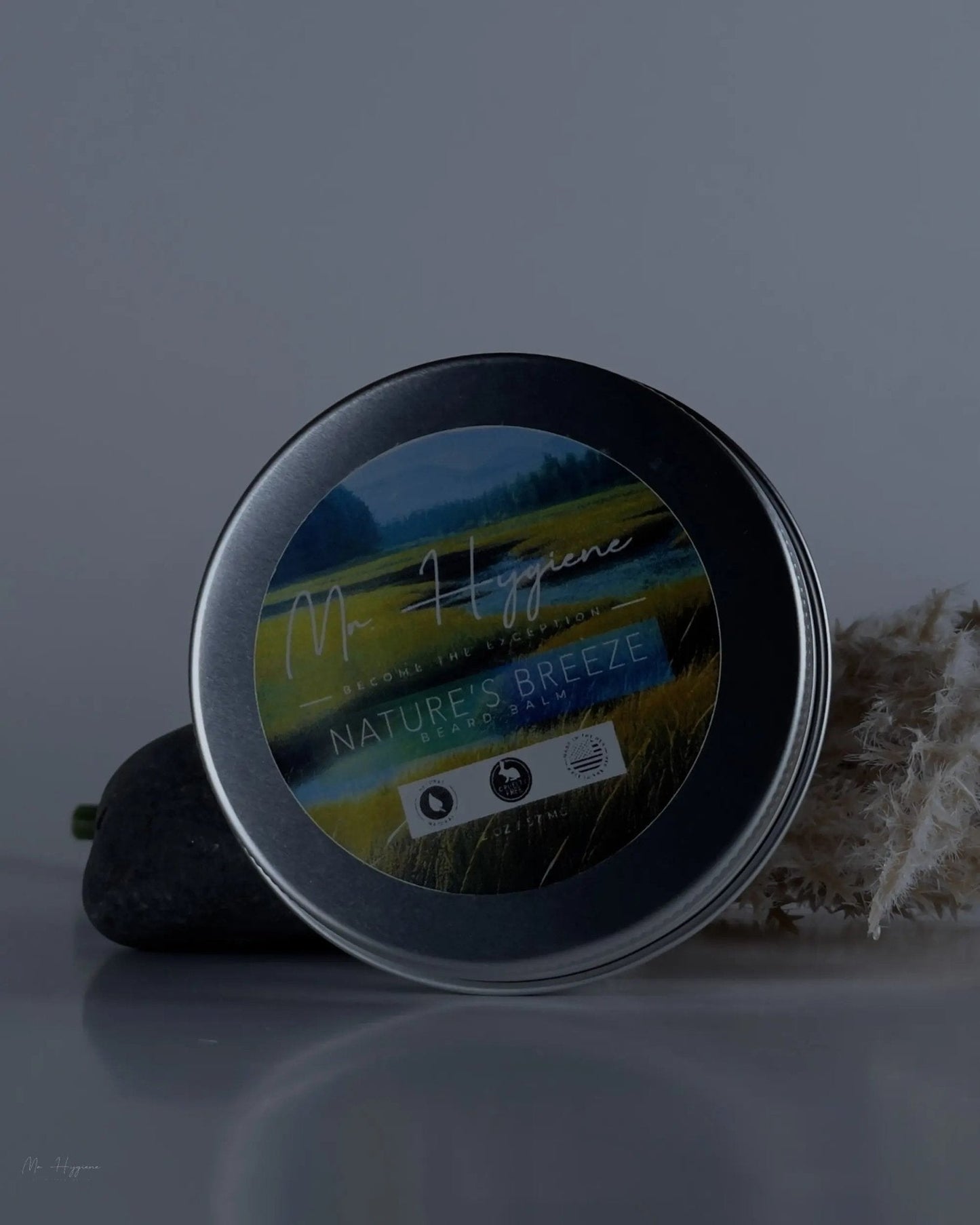 Nature's Breeze Organic Beard Balm in a round tin with nature-themed label