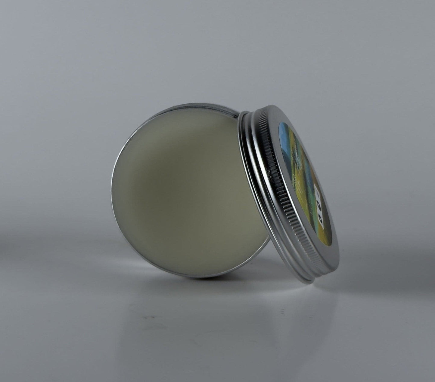 Nature's Breeze Organic Beard Balm in a metal tin for hydration and control