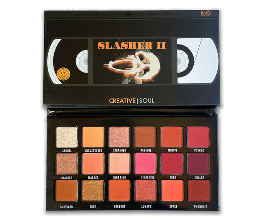 Slasher II Eyeshadow Palette with neutral shades inspired by 90s VHS horror movies, open to reveal stunning colors for everyday wear.