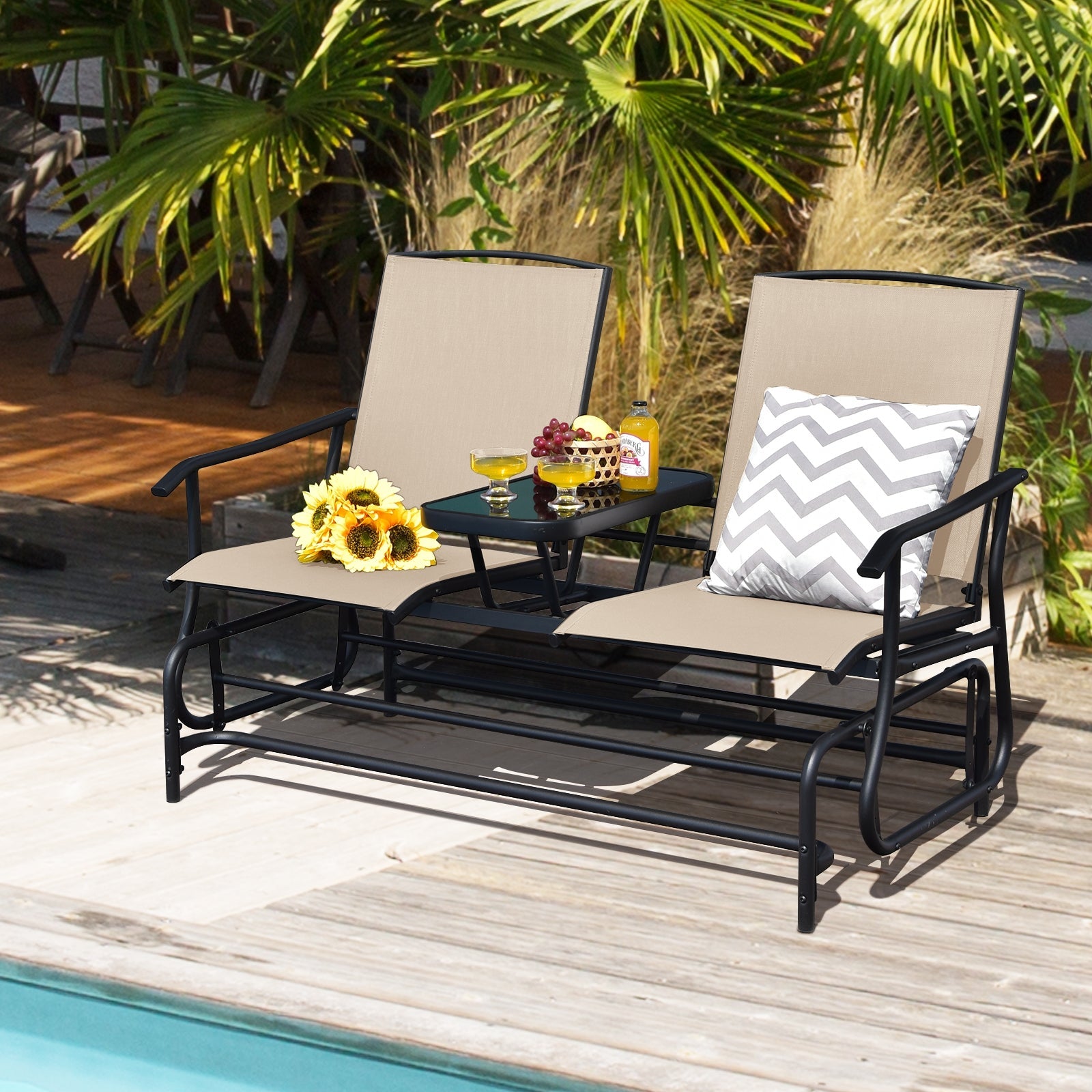 2-Person Rocking Loveseat with Mesh Fabric and Tempered Glass Table on patio with sunflowers and cushion