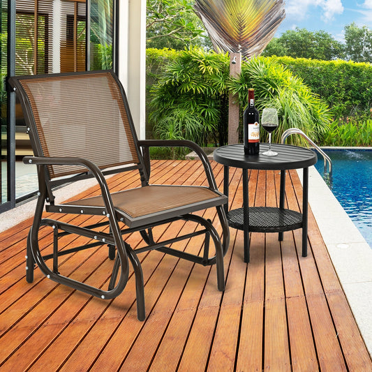 Outdoor Single Swing Glider Rocking Chair with Armrest-Brown on patio next to round table with wine bottle and glass by poolside