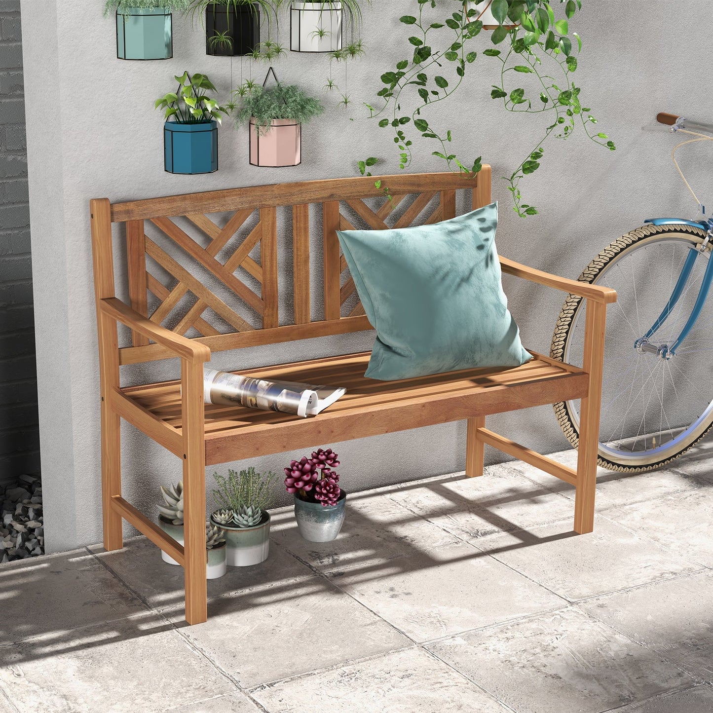 2-Person Wooden Outdoor Bench with Cozy Armrest and Backrest in a garden setting, featuring decorative backrest and green pillow.