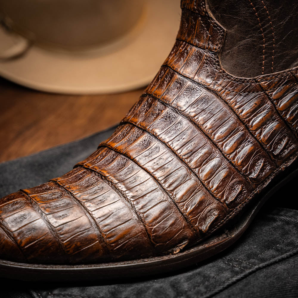 Phoenix Aged Brown cowboy boot made of genuine caiman belly skin with subtle scale pattern and round toe design