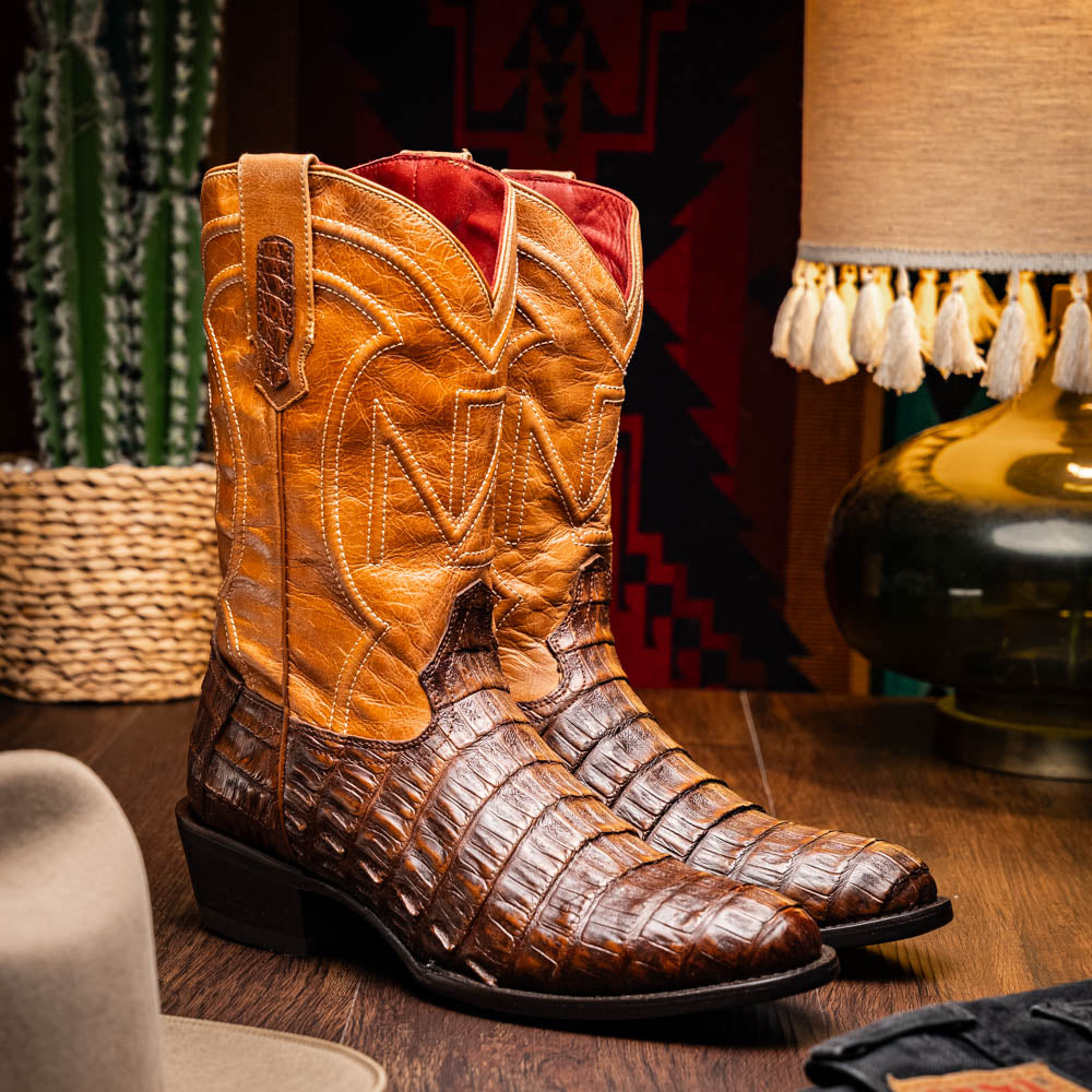 Phoenix Aged Maple cowboy boot with caiman belly skin and leather shaft in rustic setting