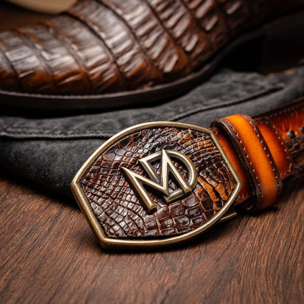 Phoenix Aged Maple Caiman Belly Skin Cowboy Boot with brown leather texture and stylish belt on display