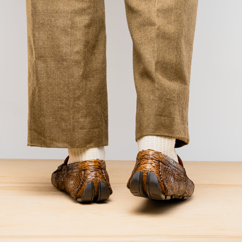 Rear view of Pia Cognac python skin driver shoes showcasing unique texture and elegant craftsmanship.