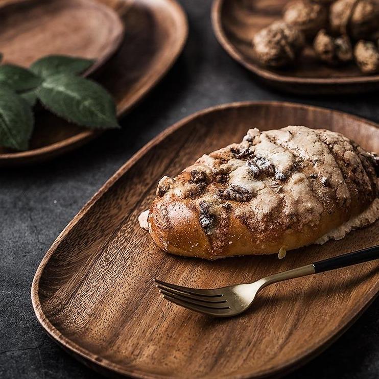Handcrafted Mateo Oval Wood Board Set 5-Piece with rustic bread and fork, enhancing modern organic table settings.