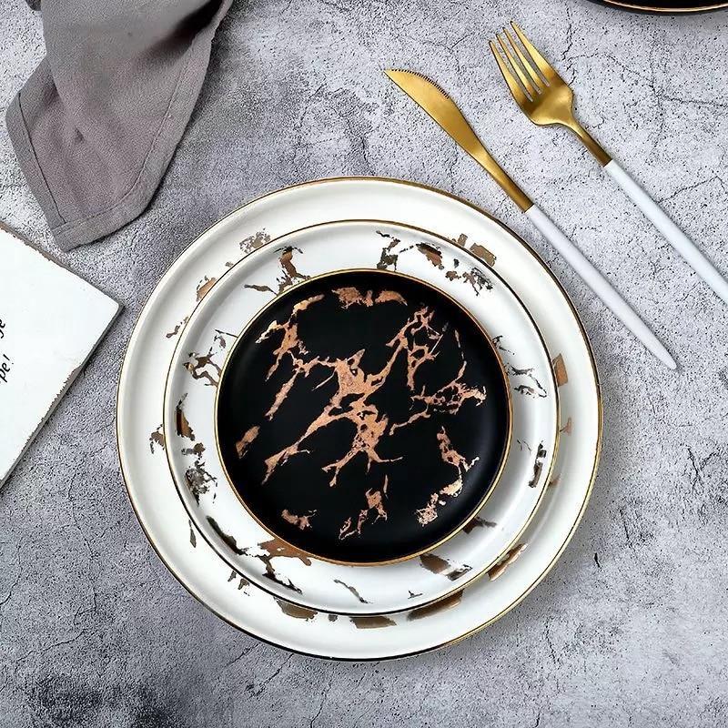 Lighting Flat Plates Nordic Collection with hand-painted marble pattern, round ceramic dinnerware set on a table setting.