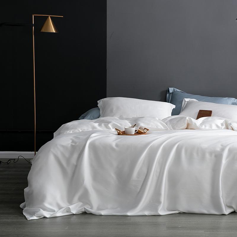 Karen Solid Color Lyocell Duvet Cover Set in white, showcasing modern and boho style on a bed with a minimalist design.