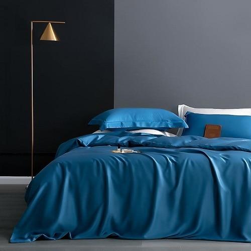 Karen Solid Color Lyocell Duvet Cover Set in vibrant blue on stylish modern bedroom setup.