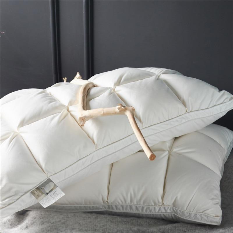 Giancarlo Goose Down Filling Pillows Set of 2 with white quilted design placed on a soft surface.