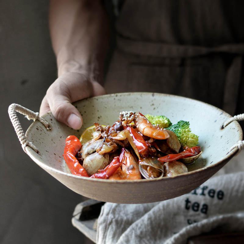 Hand-made Japanese Style Plates And Bowls with seafood dish, featuring ceramic round design with rope handles.