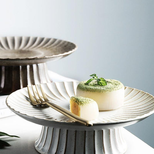 Retro Ceramic Cake Stand with solid pattern and rounded shape, featuring desserts and a fork. Elegant ceramic display stand.
