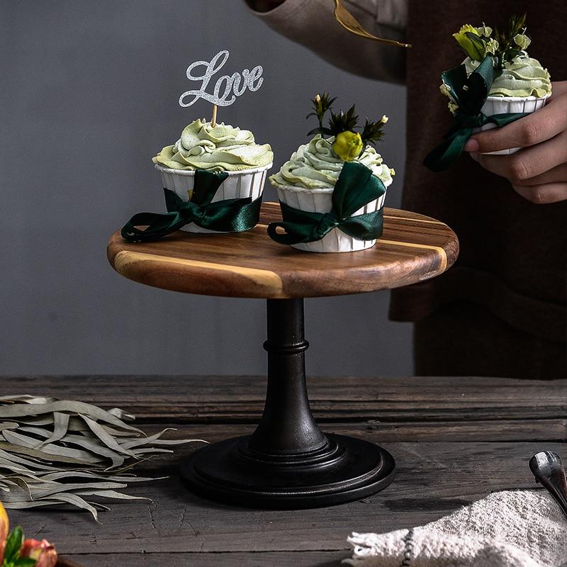Tall European Wooden Cake Tray with round solid wood design, displaying decorated cupcakes and love sign on a table.