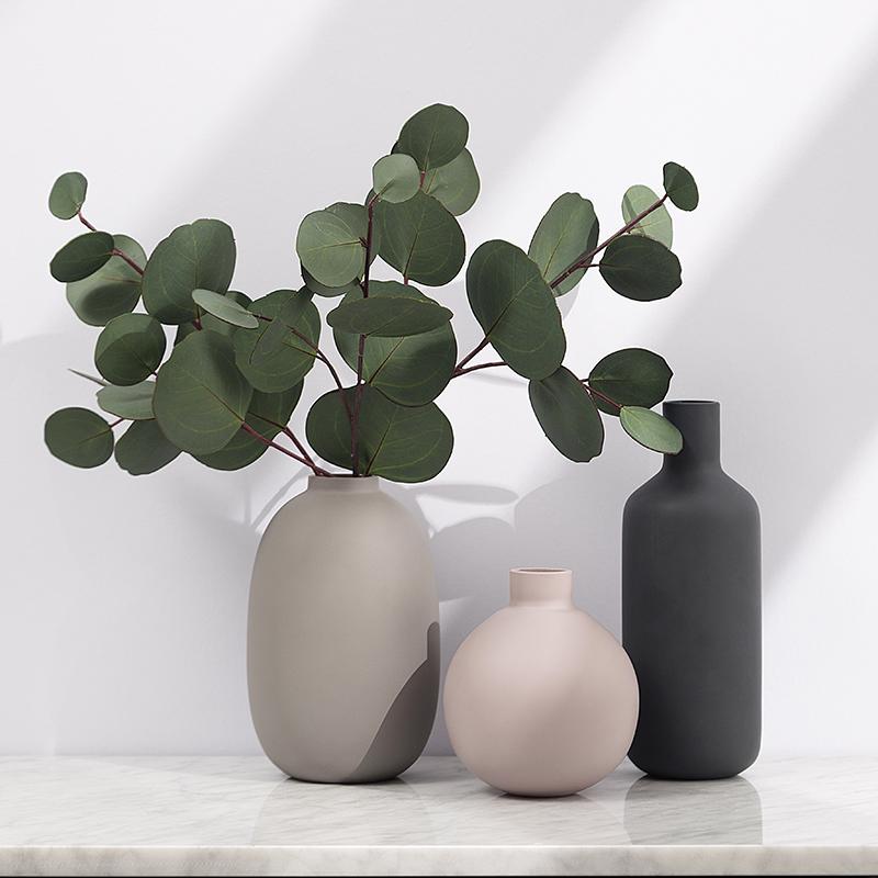 Modern Ceramic Vase set on a tabletop, featuring minimalist design in ceramic and porcelain. Perfect for contemporary decor.