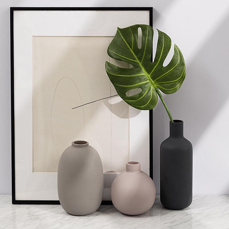 Modern Ceramic Vase set with elegant design featuring ceramic and porcelain material, perfect for tabletop decor in a modern style.