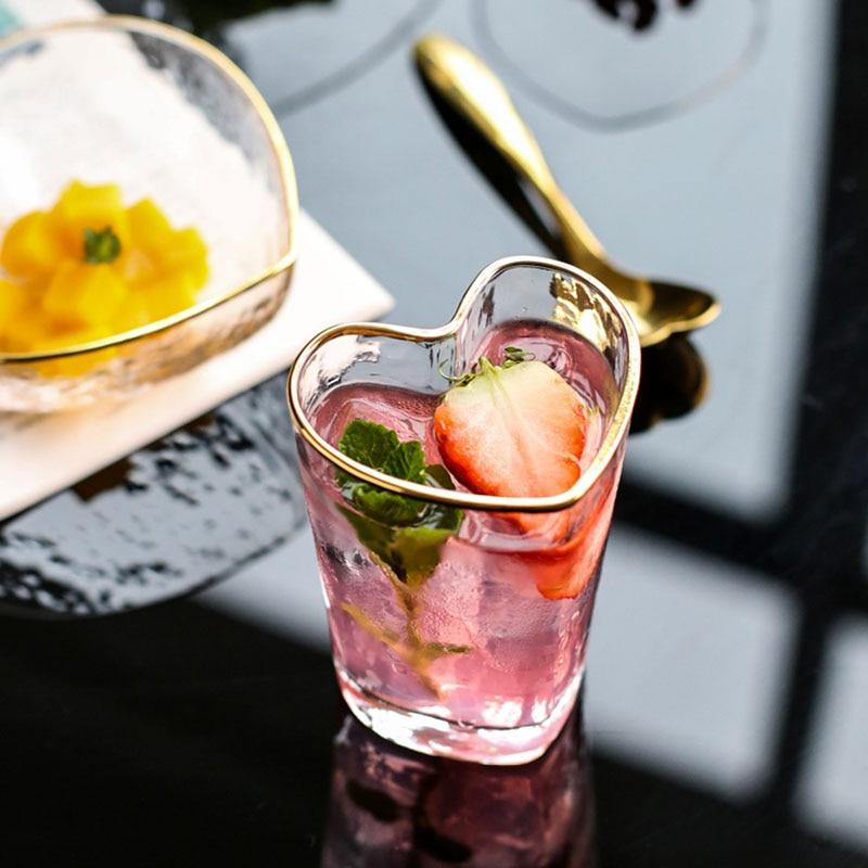 Heart-Shaped Bowl & Cup on reflective surface with drink and fruit garnish