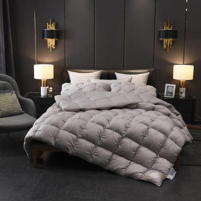Giuseppina 1000 Thread Count Goose Down Comforter Duvet in elegant bedroom setting with soft lighting