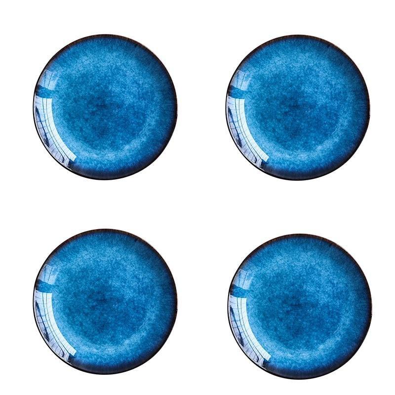 Pallas Plate Set Of 4 featuring handpainted ceramic plates with a glazed finish, perfect for enhancing elegant dining settings.