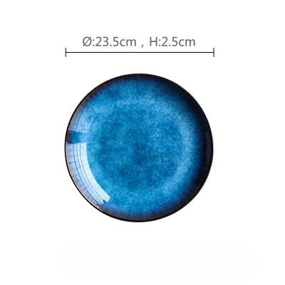 Blue ceramic plate from Pallas Plate Set Of 4, showcasing handpainted glaze pattern and minimalist design. Diameter: 23.5cm, Height: 2.5cm.