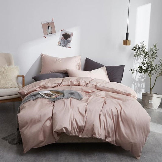 Modern bedroom with PeachPuff Grace Silk Duvet Cover Set (Premium Egyptian Cotton) 600TC on bed, surrounded by cozy decor.