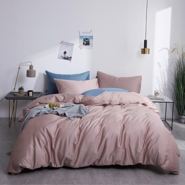 MistyRose Grace Silk Duvet Cover Set (Premium Egyptian Cotton) 600TC bedding set displayed on a bed in a minimalistic bedroom.