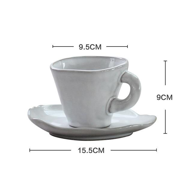 Nanna Bowls And Dishes - White ceramic cup with handle and matching saucer featuring dimensions: 9.5cm diameter, 9cm height, 15.5cm saucer.