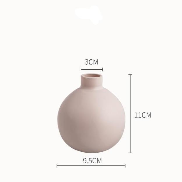 Modern Ceramic Vase with sleek porcelain design, tabletop style, dimensions 3cm x 9.5cm x 11cm, ideal for modern decor.
