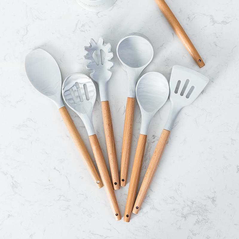 Premium Silicone Cooking Set Tools with wooden handles, temperature resistant for microwave, oven, toaster, and steamer use.