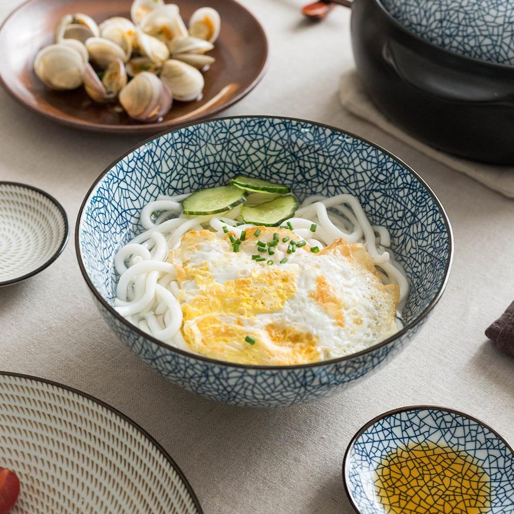 Modern Japanese Ceramic Bowls with intricate under-glazed porcelain design, eco-friendly and FDA certified, filled with noodles