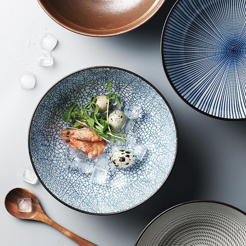 Modern Japanese Ceramic Bowls with intricate patterns, featuring under glazed porcelain; eco-friendly certified product displayed with food.