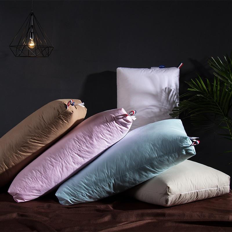 Giovanni Goose Down Pillows Cotton Made Set of 2 in various colors on a stylish bed setup.