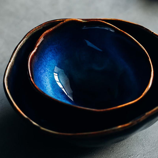 European Porcelain Deep Bowl with dark blue glaze highlighting its elegant design, handcrafted and eco-friendly, perfect for the dinner table.