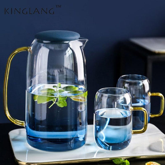 Colored Glass Carafe and Glass Set with eco-friendly design, featuring a round transparent glass carafe and two mugs.
