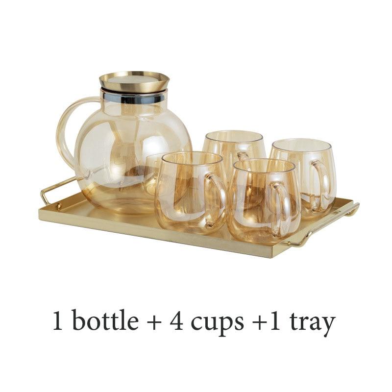 Luxury Nordic Drinking Set featuring 1 round glass bottle, 4 transparent cups on eco-friendly tray, elegant drinkware.