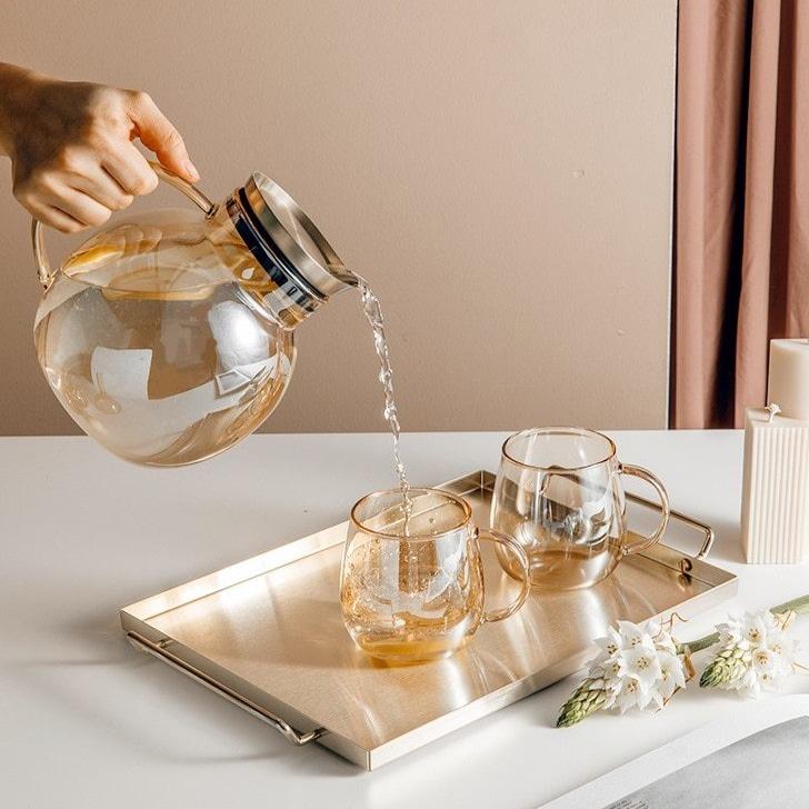 Luxury Nordic Drinking Set with round glass pitcher and eco-friendly transparent glass cups on a tray